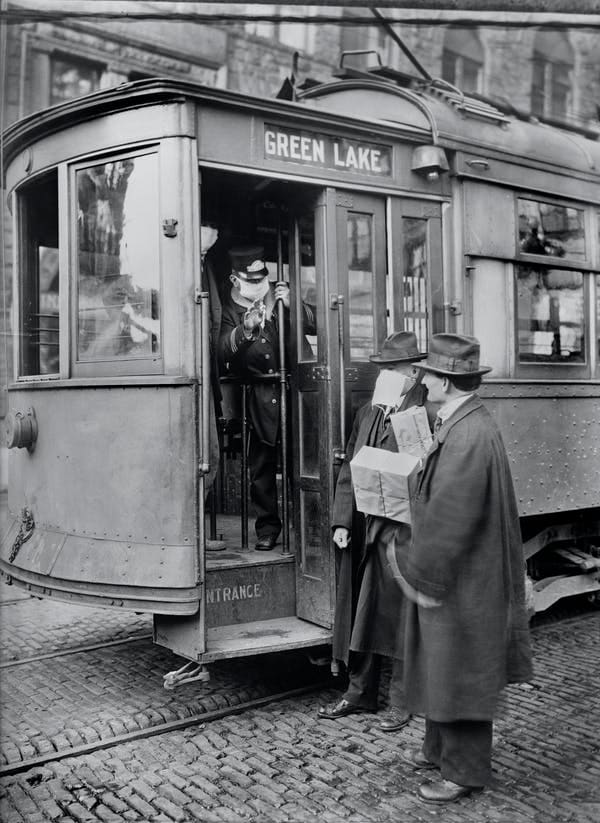 No mask, no service on streetcar in 1918. Universal History Archive/Universal Images Group via Getty Images