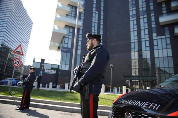 Italian police officers man a roadblock in Milan, Italy on March 16, 2020. Italy is on a nationwide lockdown to contain the COVID-19 virus outbreak. AP/Luca Bruno