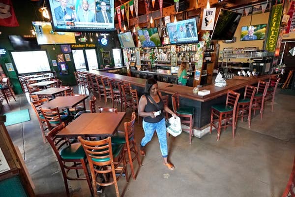 A customer picks up takeout food from a restaurant in Houston, Texas. AP Photo/David J. Phillip