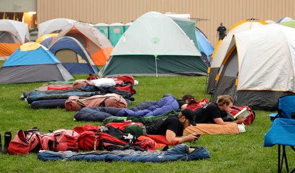 Fire camps leave little room for social distancing or hand-washing. AP Photo/Ted Warren