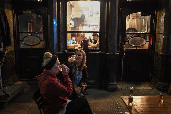 Guests enjoy one last pint at the Red Lion pub on March 20, 2020, the day it closed due to the coronavirus pandemic. Peter Summers/Getty Images