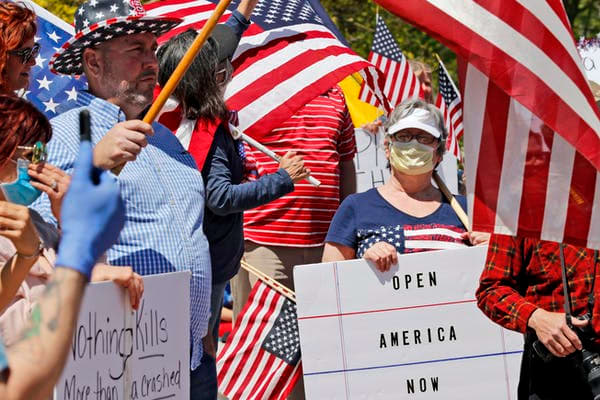 Outside the Missouri Capitol on April 21, some protesters wore masks – though others didn’t. AP Photo/Jeff Roberson