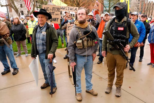 Armed protesters were among the crowd in Michigan on April 30. Jeff Kowalsky/AFP via Getty Images
