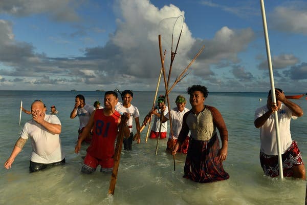 Locals in Tuvalu, a Pacific island nation vulnerable to climate change. Like coronavirus, global warming does not respect borders. Mick Tsikas/AAP
