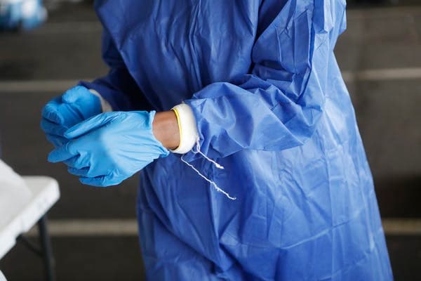 Health care workers are among those affected by budget cuts. Octavio Jones/Getty Images