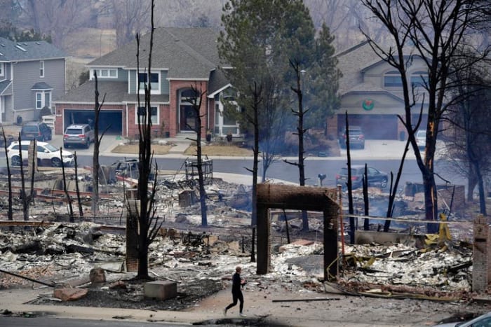 Nearly 1,000 homes burned in Boulder County, Colo., as strong winds whipped a grass fire through unusually dry landscape on Dec. 30, 2021. Helen H. Richardson/MediaNews Group/The Denver Post via Getty Images