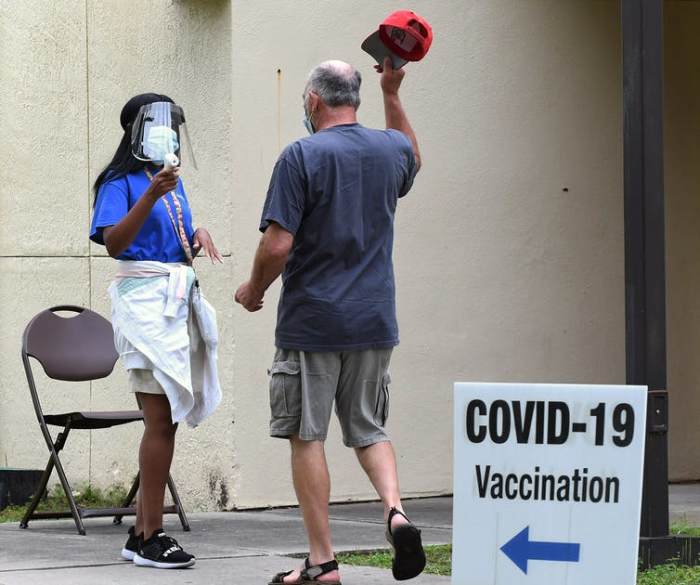 You might not notice any symptoms at all after your COVID-19 vaccine. SOPA Images/LightRocket via Getty Images