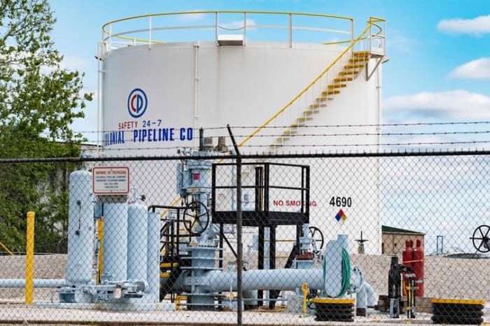 Cyber defenses for critical infrastructure are considerably more challenging to implement than installing barbed wire fences around fuel storage depots. Jim Watson/AFP via Getty Images