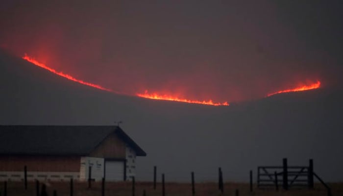 One of Colorado’s largest wildfires, 2020’s East Troublesome Fire, crossed the Continental Divide and was burning at elevations around 9,000 feet in October, when snow normally would have been falling. AP Photo/David Zalubowski