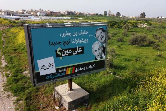 A campaign billboard for the Joint List of Arab parties mocked Netanyahu’s promise of a ‘new approach.’ Amir Levy/Getty Images
