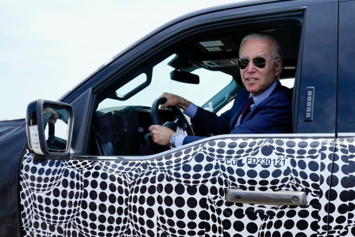 President Joe Biden, a self-described ‘car guy,’ drives a test model F-150 Lightning truck at Ford’s Dearborn Development Center on May 18, 2021. AP Photo/Evan Vucci