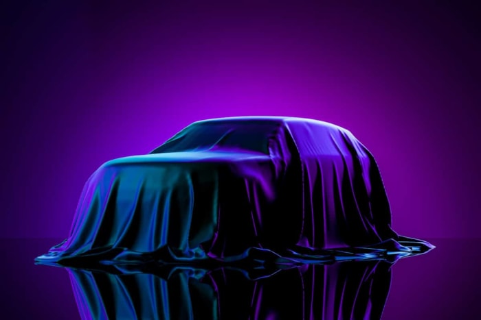 Figure 1: Presentation of car covered with cloth on dark illuminated by violet neon light.