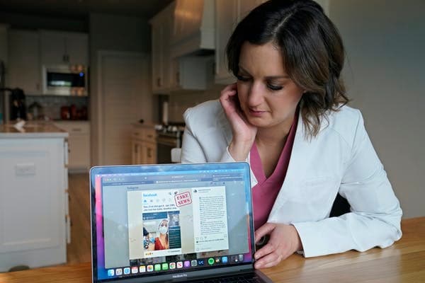 Anti-vaccine activists use sophisticated misinformation techniques, including hijacking social media accounts of health care workers like this physician and presenting misinformation via the stolen identities. AP Photo/Sue Ogrocki