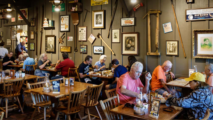 Customers eating at a Cracker Barrel Old Country Store and Restaurant. lead.