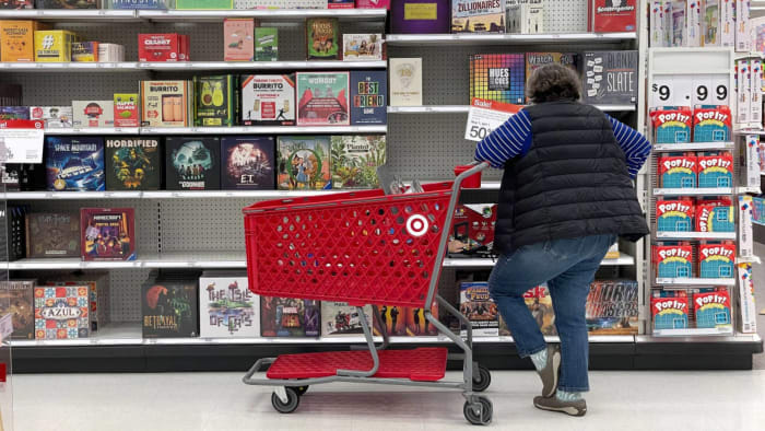A Target customer looks at a display of board games. Lead.