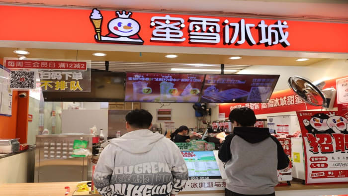 Consumers buy bubble tea beverages at a Mixue Bingcheng store in Beijing, China. lead.