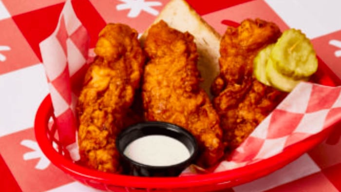 Nashville Hot Chicken with a side of pickles.