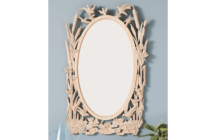 Hand carved menagerie mirror