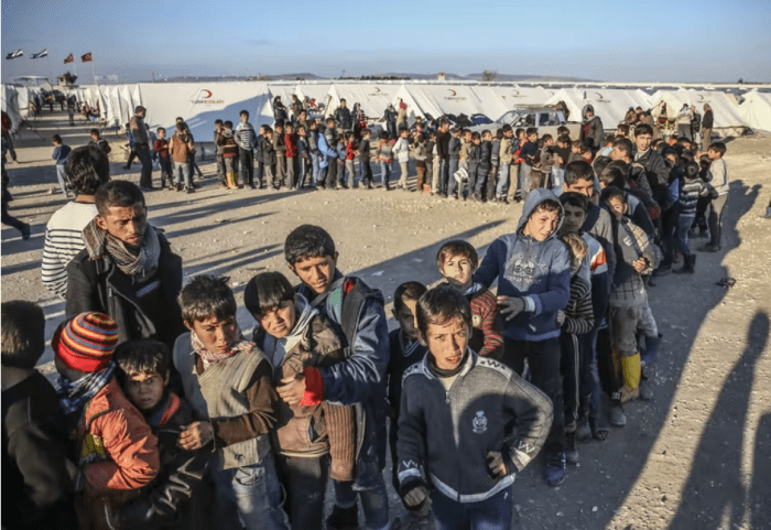 Syrians who fled bombing in Aleppo, Syria, are seen at a tent city near the Turkish-Syrian border in 2016. Fatih Aktas/Anadolu Agency/Getty Images