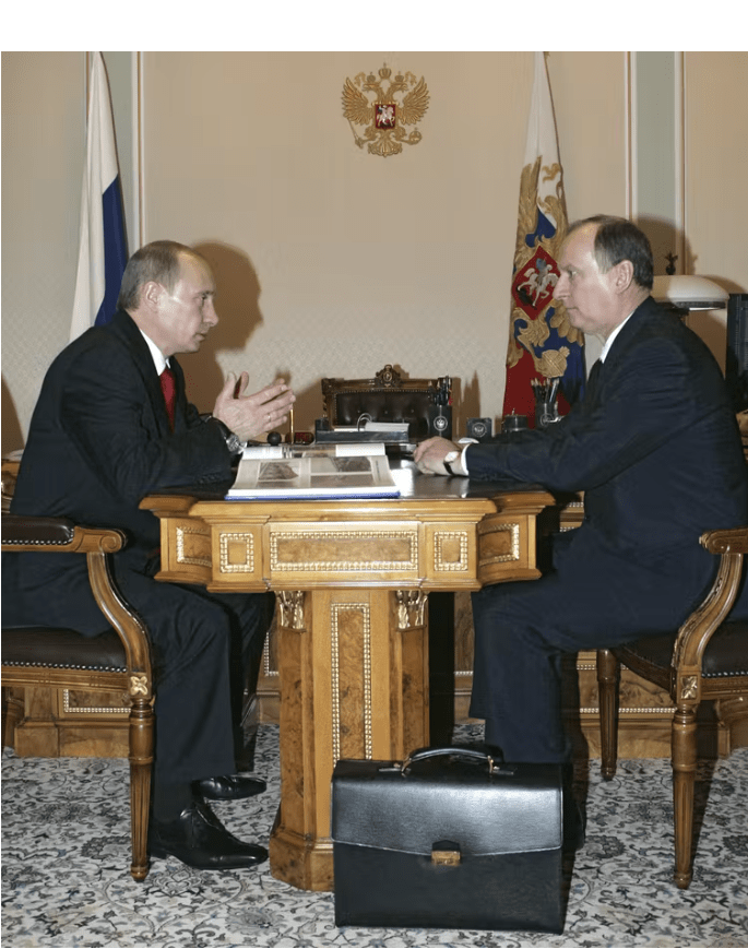 Russian President Vladimir Putin (left) speaks with Nikolai Patrushev, Director of the Federal Security Service (FSB), during a meeting on Dec. 29, 2007. Mikhail Klimentyev/RIA NOVOSTI/AFP via Getty Images)