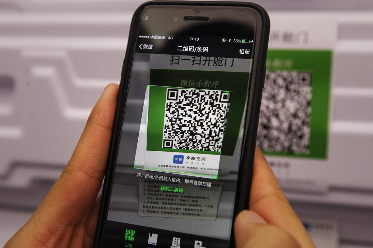A Chinese consumer using a QR code to make a payment.