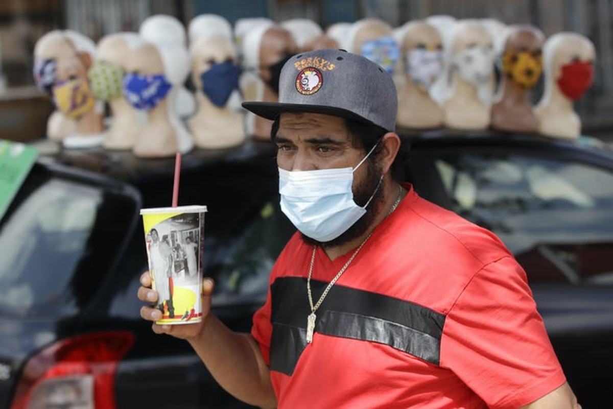A surgical or cloth mask can’t block out 100% of the virus, but it can reduce how much you inhale. AP Photo/Marcio Jose Sanchez, File