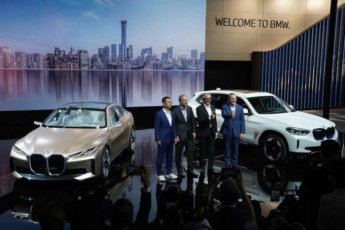 BMW executives in Beijing at the unveiling of new electric luxury cars at the Auto China 2020 show. AP Photo/Ng Han Guan