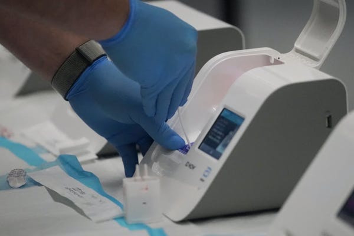 Rapid tests like the Abbott ID Now require only small, portable machines and can give results in 15 minutes, but they sacrifice accuracy. AP Photo/Jeff Chiu