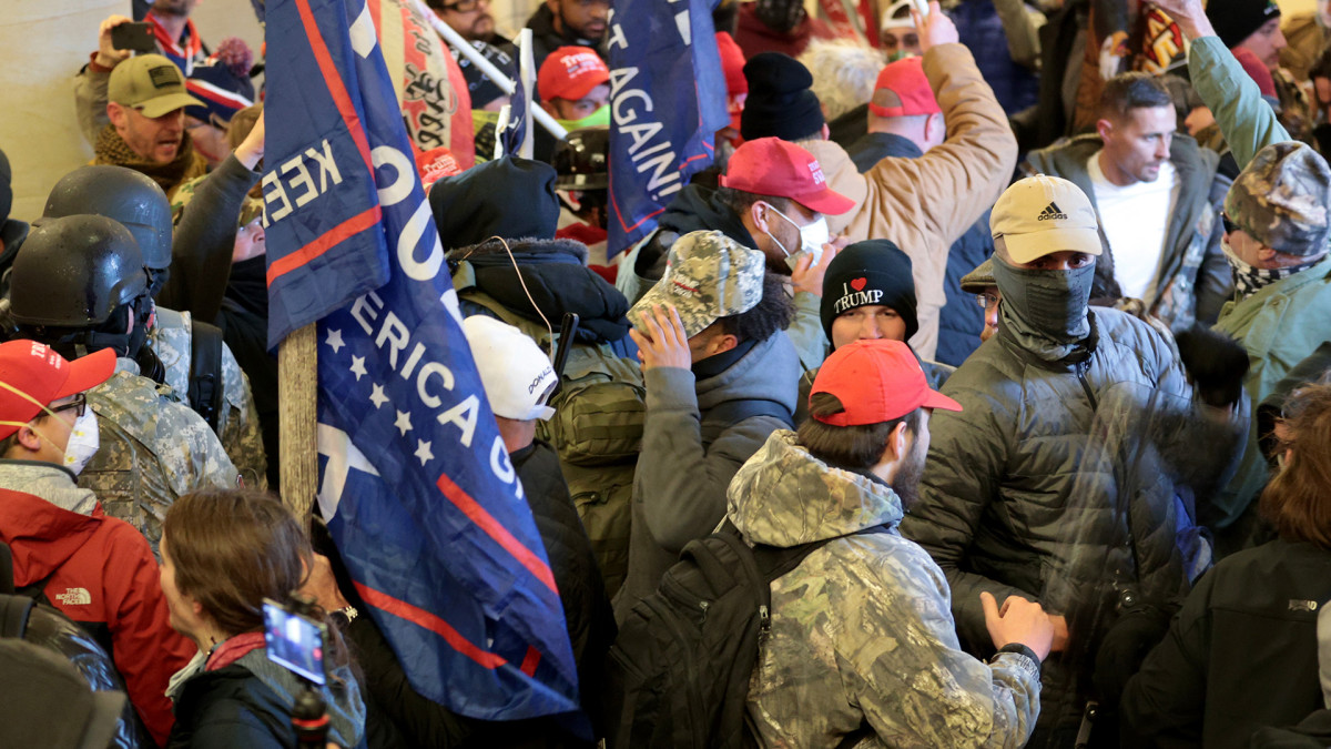 Dow closes record as supporters of the Trump Storm Capitol