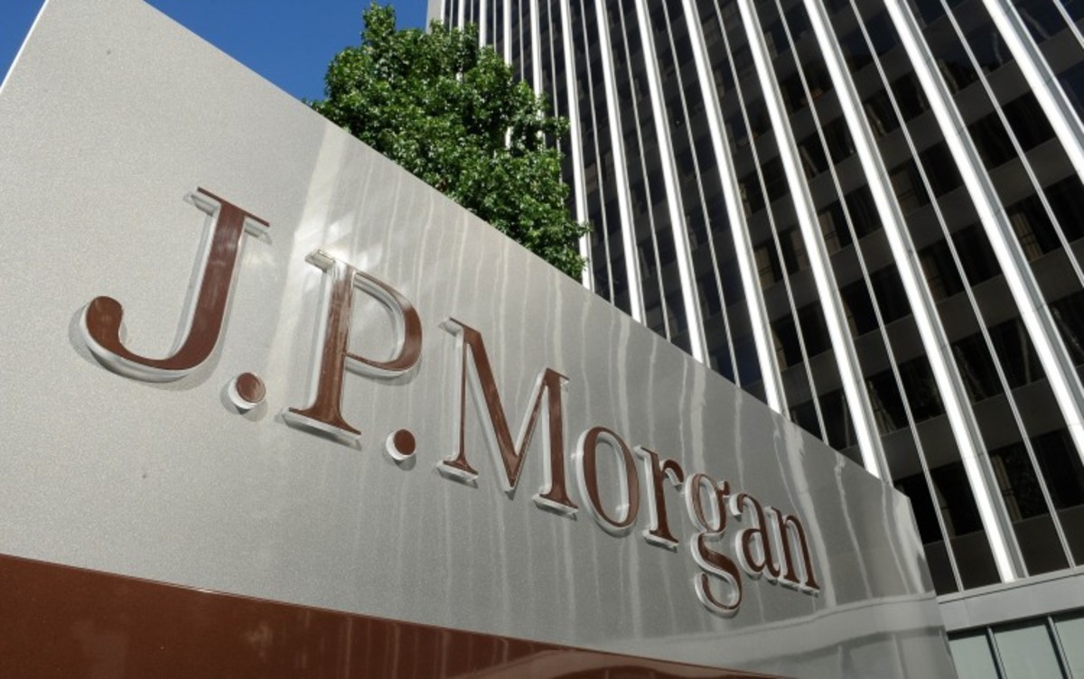 JPMorgan shares rise amid beat on third-quarter earnings, but deal fee collapses