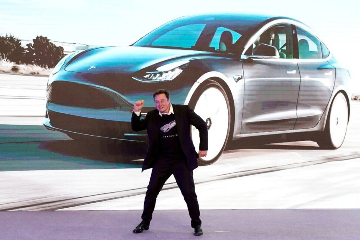 Elon Musk dances onstage during a delivery event for Tesla's China-made Model 3 cars in Shanghai on January 7, 2020.