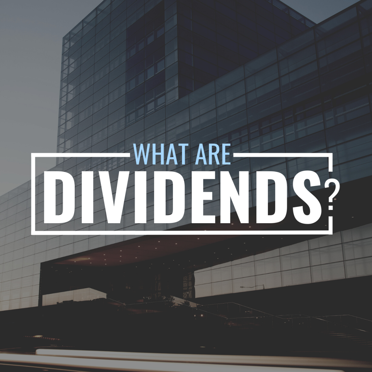 Darkened photo of a large office building with stylized text overlay that reads "What Are Dividends?"