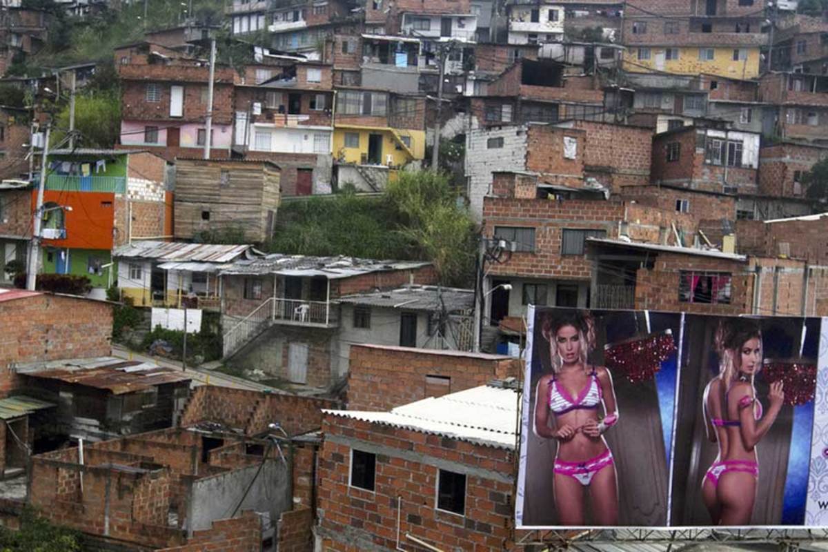 A-billboard-with-pictures-of-a-lingerie-model-is-seen-in-front-of-the-Commune-northwest-of-Medellin-Colombia.