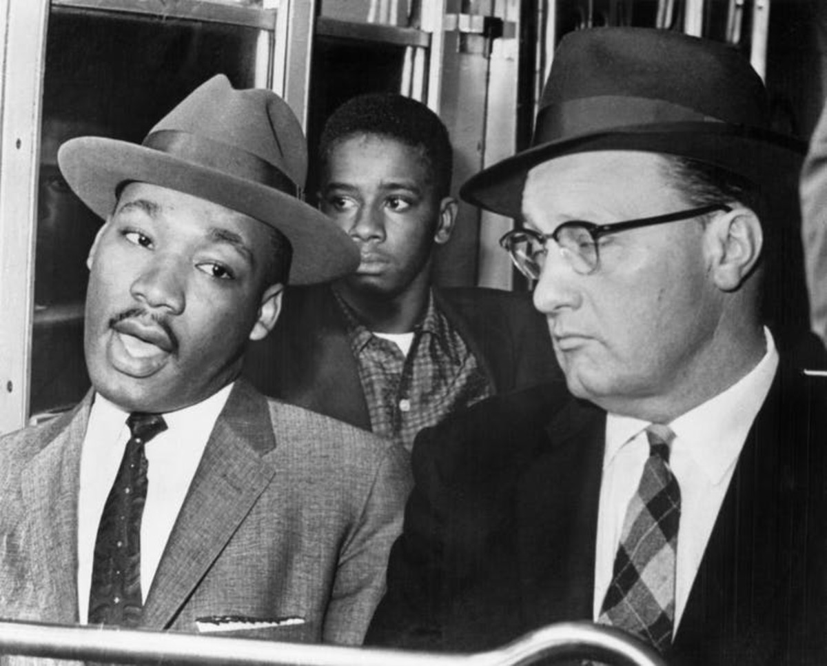 Martin Luther King Jr. rides a Montgomery bus up front with Glenn Smiley of Texas. Photo by Bettmann Archive/Getty Images