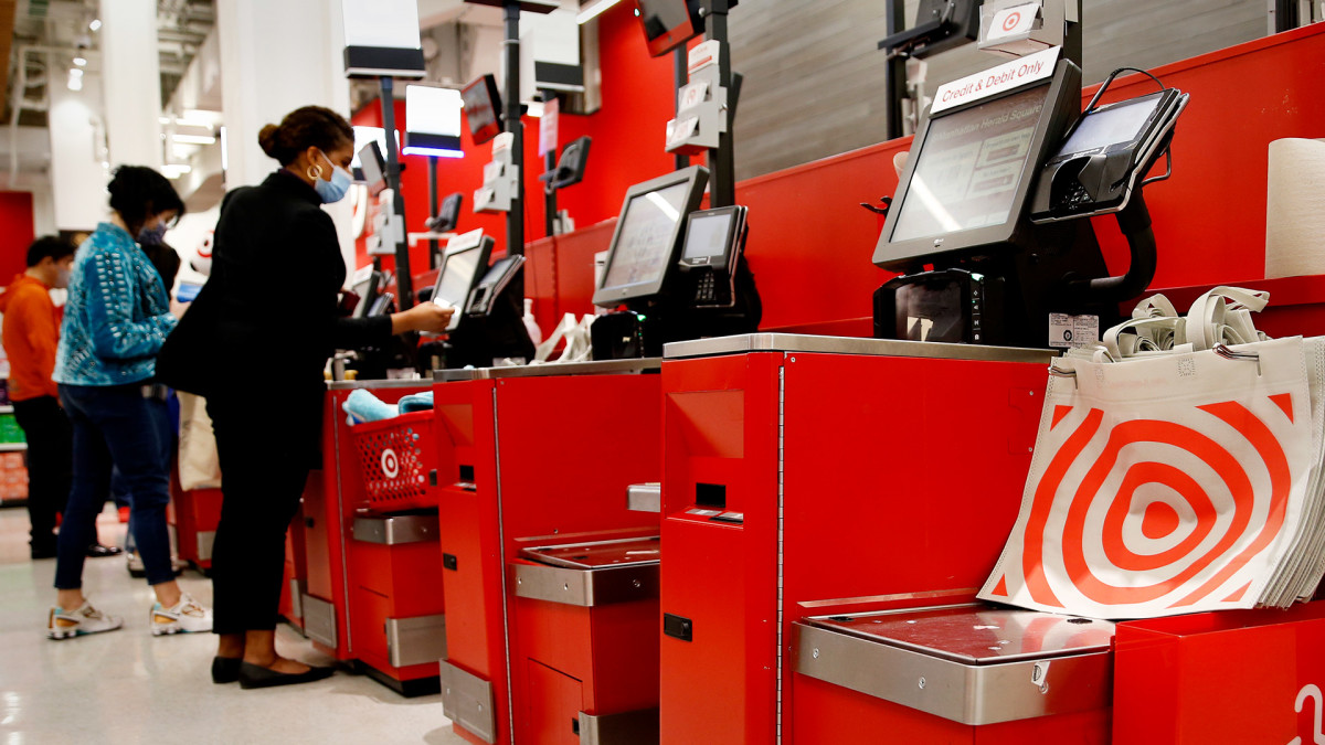 People use self checkout at a Target. Lead JS