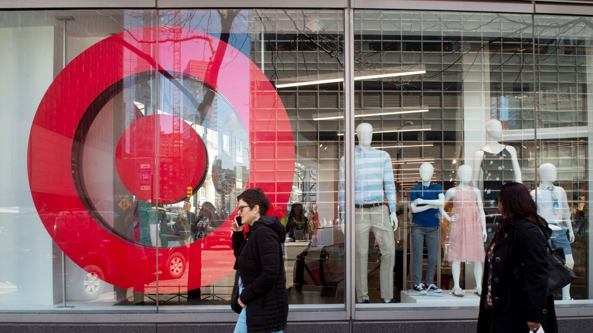 People walk by a Target window. Target Lead JS