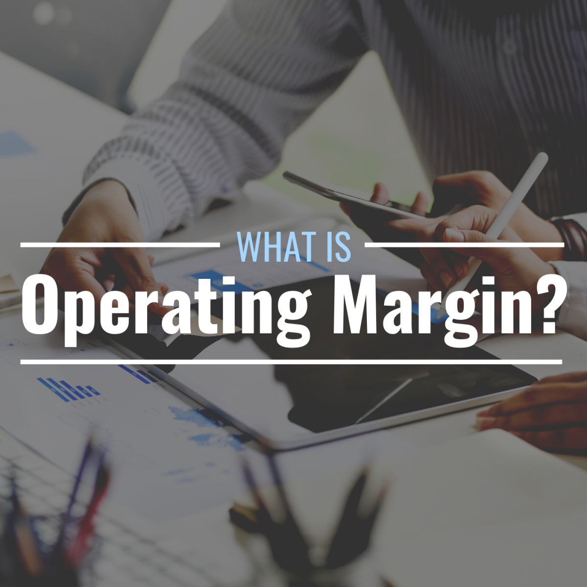 Photo of a people working on financial data with text overlay that reads "What Is Operating Margin?"