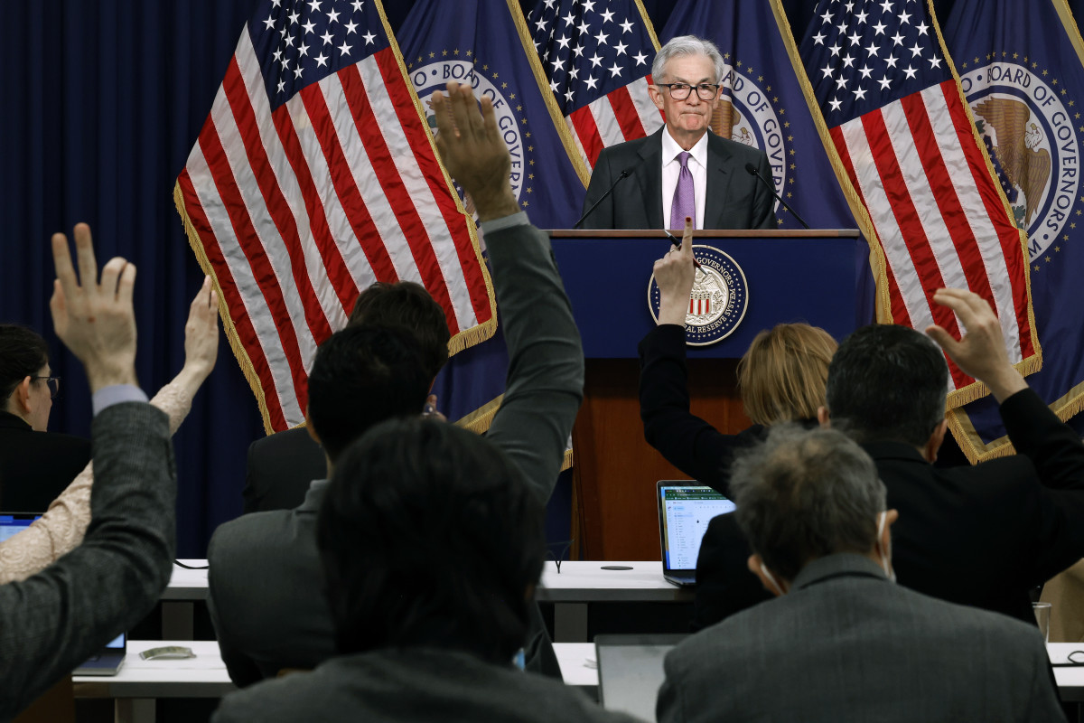 WASHINGTON, DC - MARCH 20: Reporters raise their hands to ask questions of Federal Reserve Bank Chair Jerome Powell during a news conference at the bank's William McChesney Martin building on March 20, 2024 in Washington, DC. Following a meeting of the Federal Open Markets Committee, Powell announced that the Fed left interest rates unchanged at about 5.3 percent, but suggested it may cut rates three times later this year as inflation eases. (Photo by Chip Somodevilla/Getty Images)