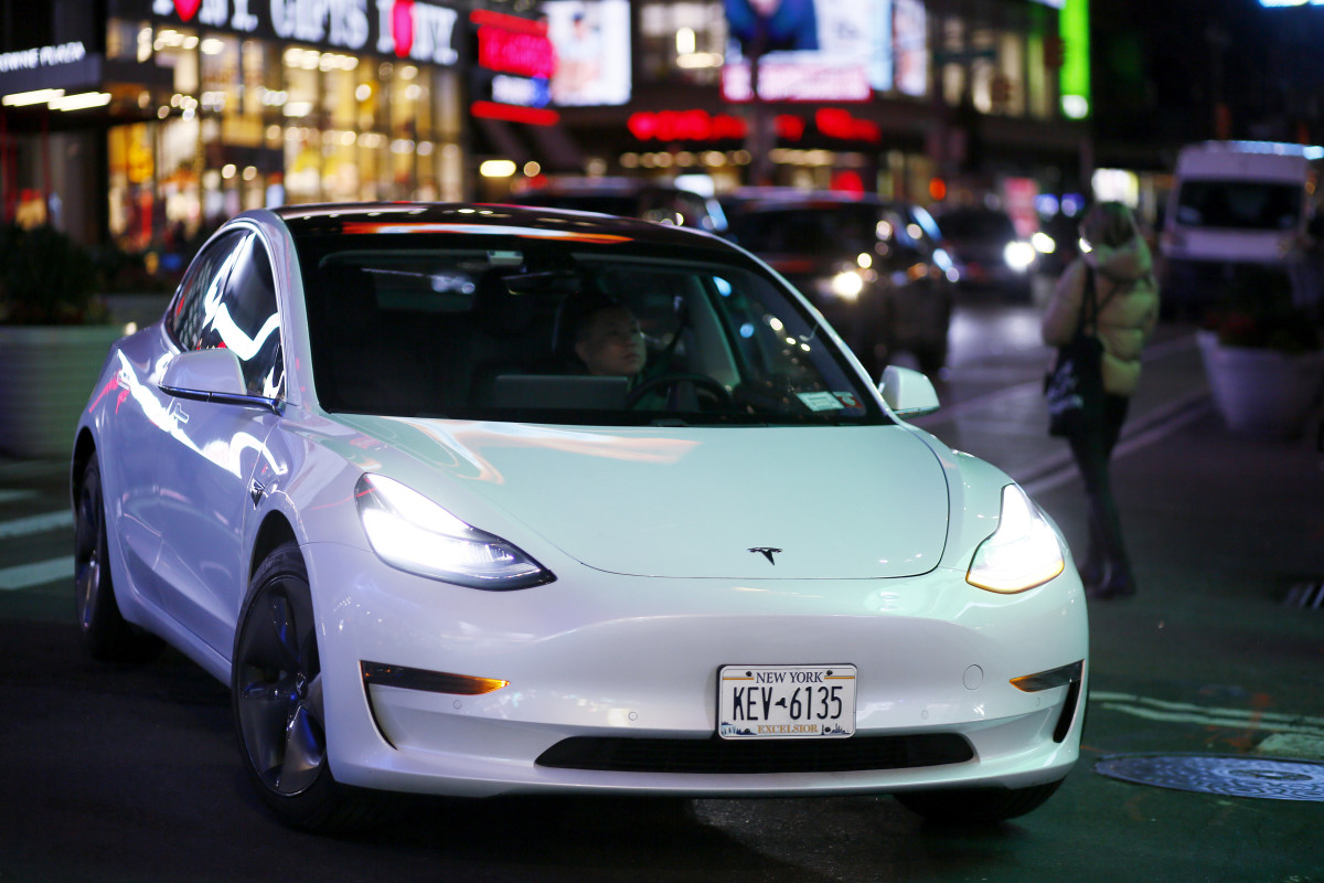 NEW YORK, NEW YORK - JANUARY 26: A Tesla car drives at Times Square on January 26, 2023 in New York City. Tesla reported a 12% jump in profit in the last quarter of 2022. (Photo by Leonardo Munoz/VIEWpress)