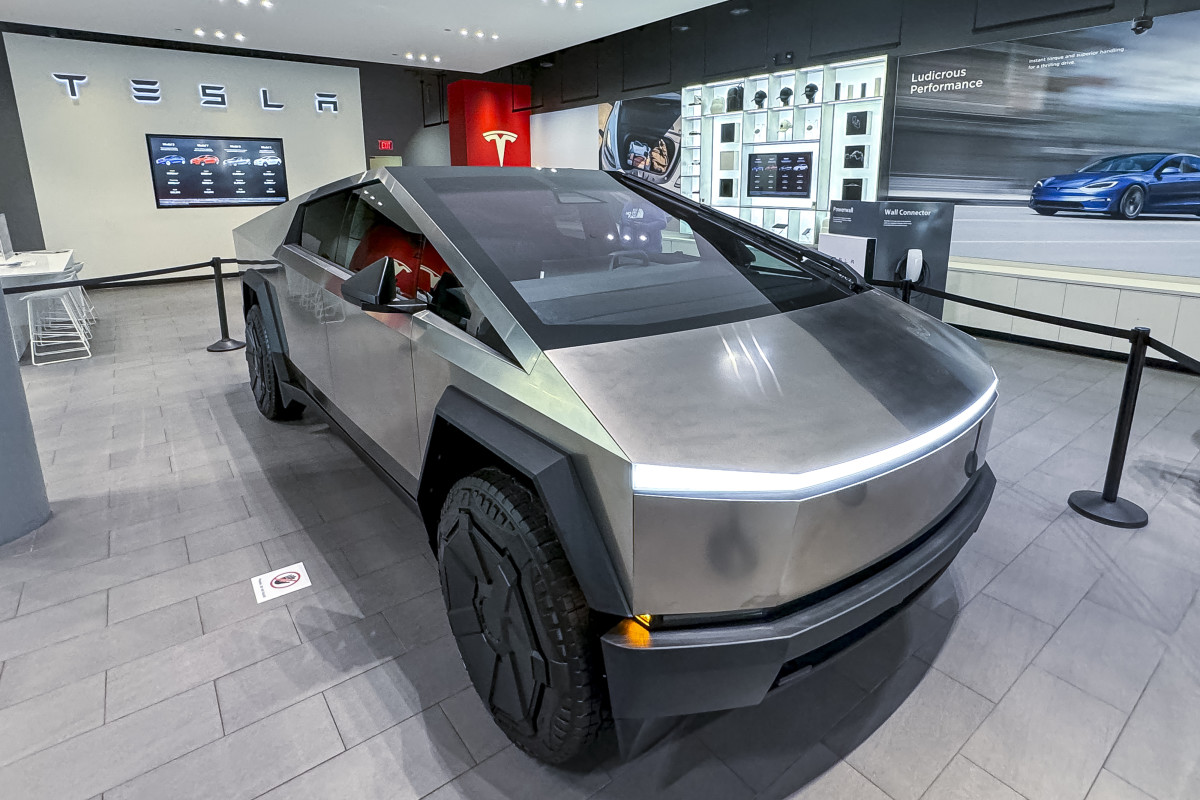 https://www.thestreet.com/.image/t_share/MjAyNTg2MDcwMjIxNTk1NzE2/teslas-cybertruck-on-display-at-a-showroom.jpg