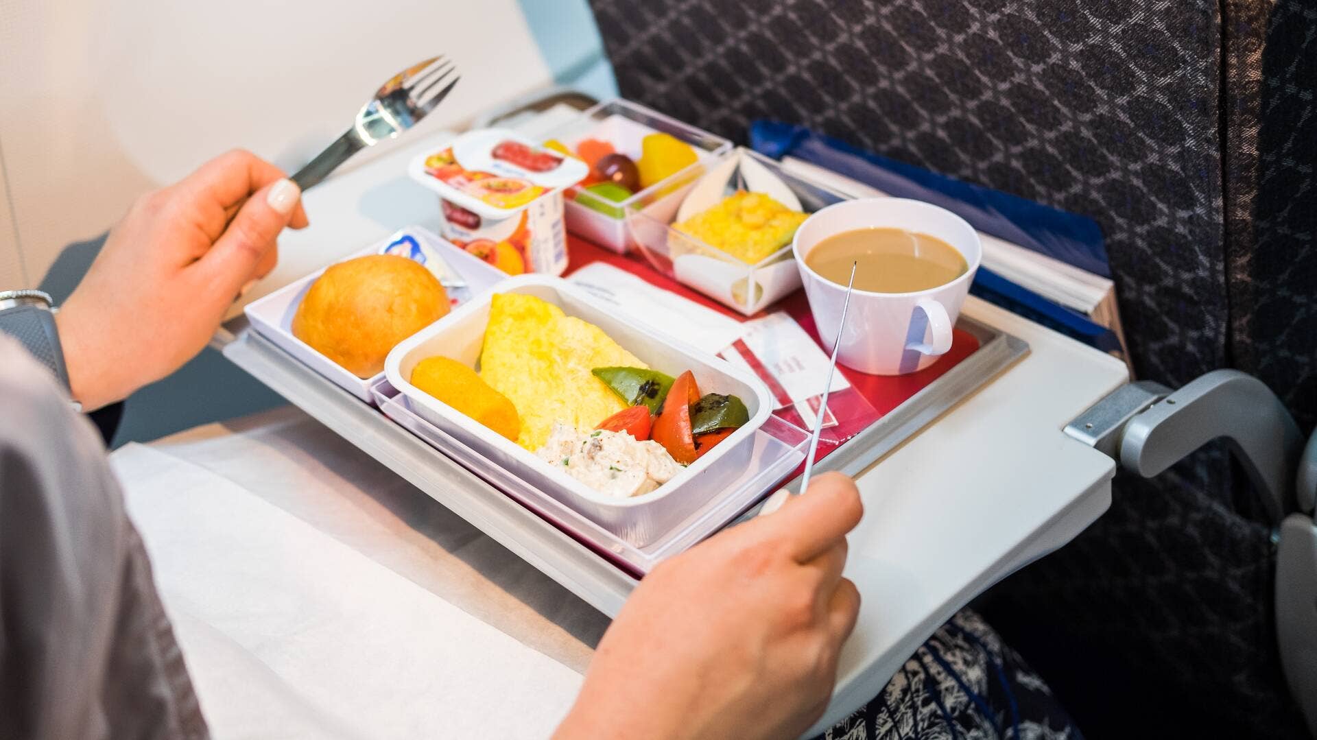 Image showcasing TSA says this common snack is banned from flights you take - TheStreet